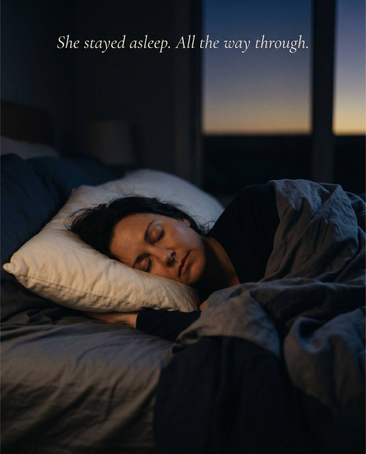 Woman sleeping peacefully through the night, pre-dawn light through the window — She stayed asleep. All the way through.